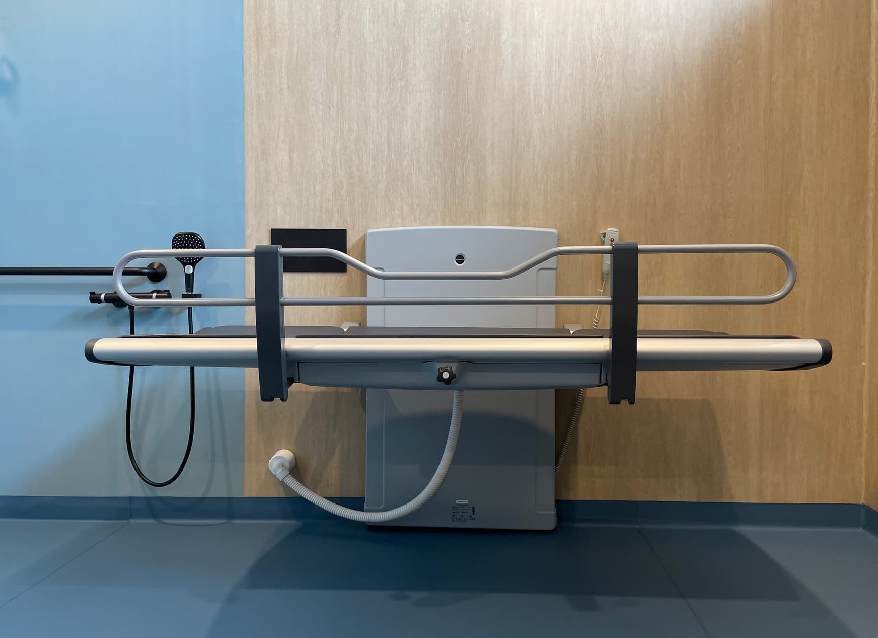 Adjustable changing table in a Changing Places bathroom